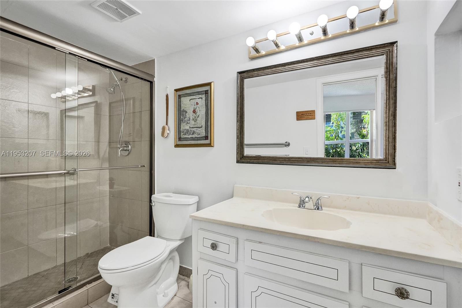 3511 Inverrary Drive, Unit 107 Lauderhill, FL 33319 - Photo 33 of 47 a bathroom with a sink toilet and shower