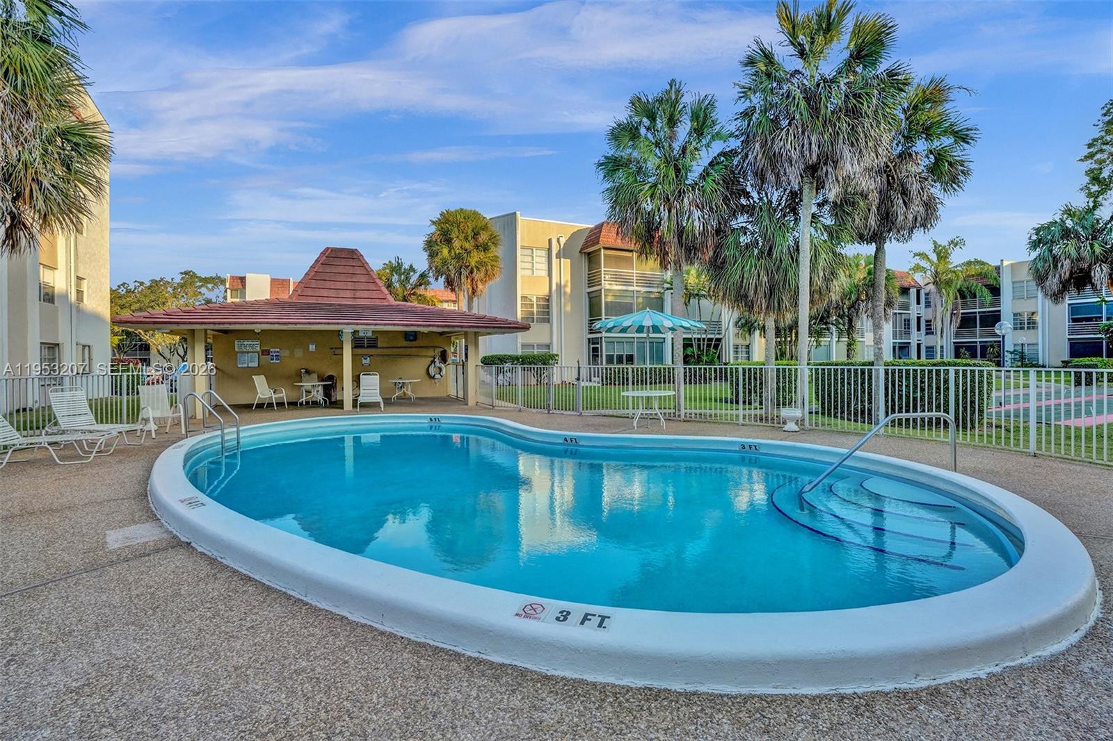 3511 Inverrary Drive, Unit 107 Lauderhill, FL 33319 - Photo 38 of 47 a view of a swimming pool and a yard