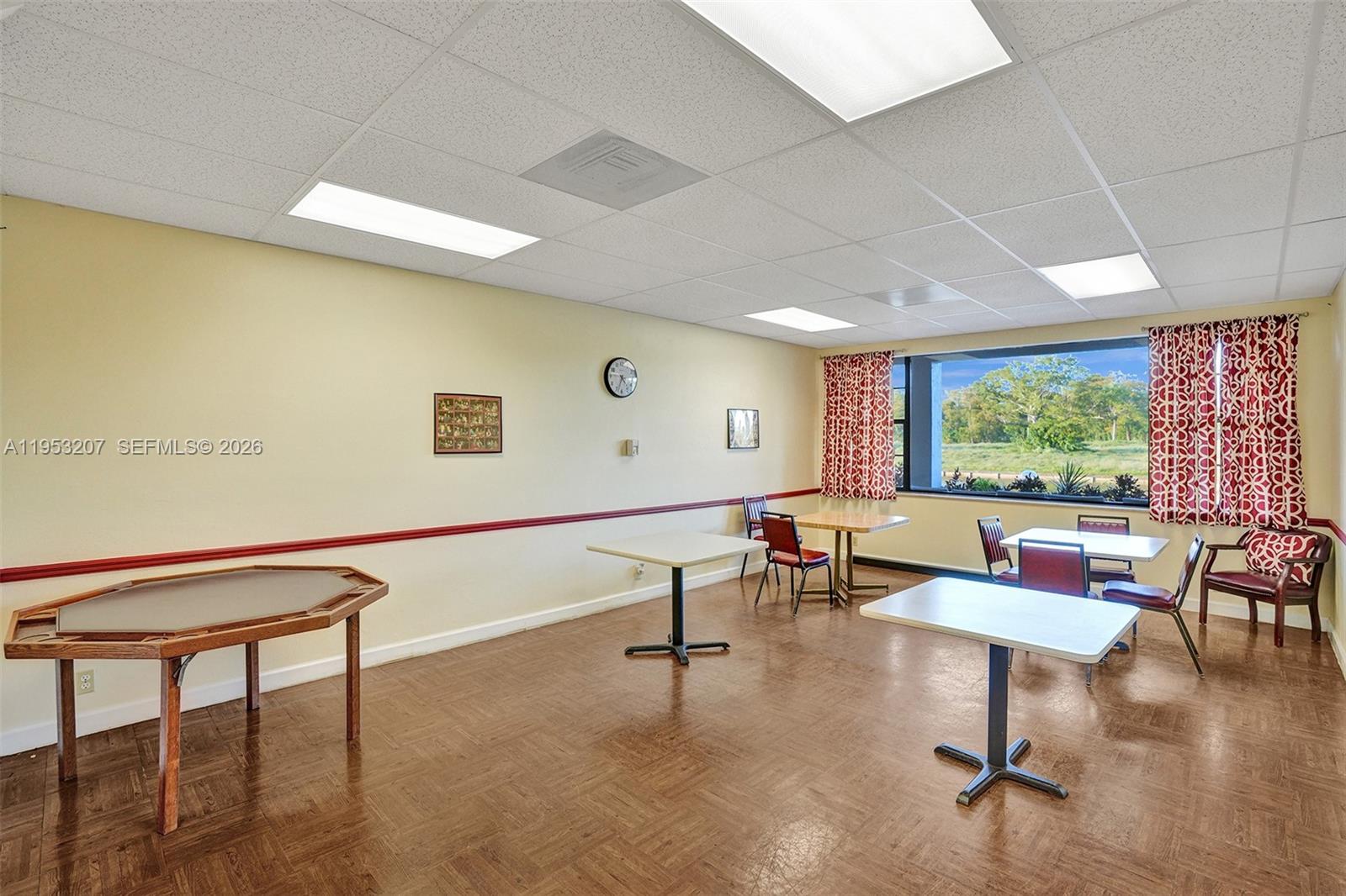 3511 Inverrary Drive, Unit 107 Lauderhill, FL 33319 - Photo 41 of 47 a living room with furniture and a large window