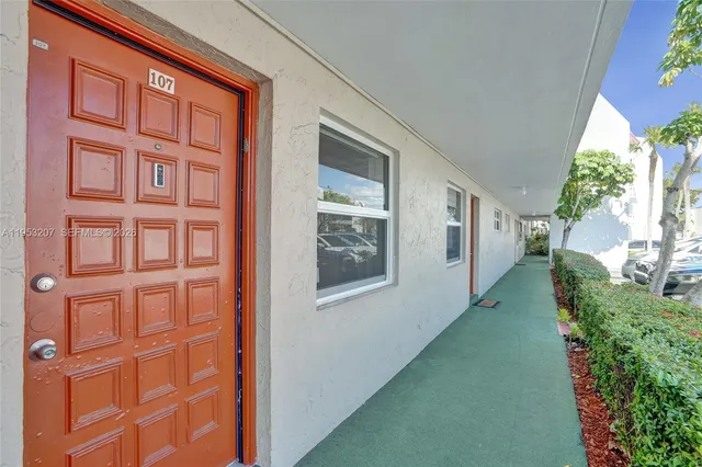 a view of a brick house with a large window