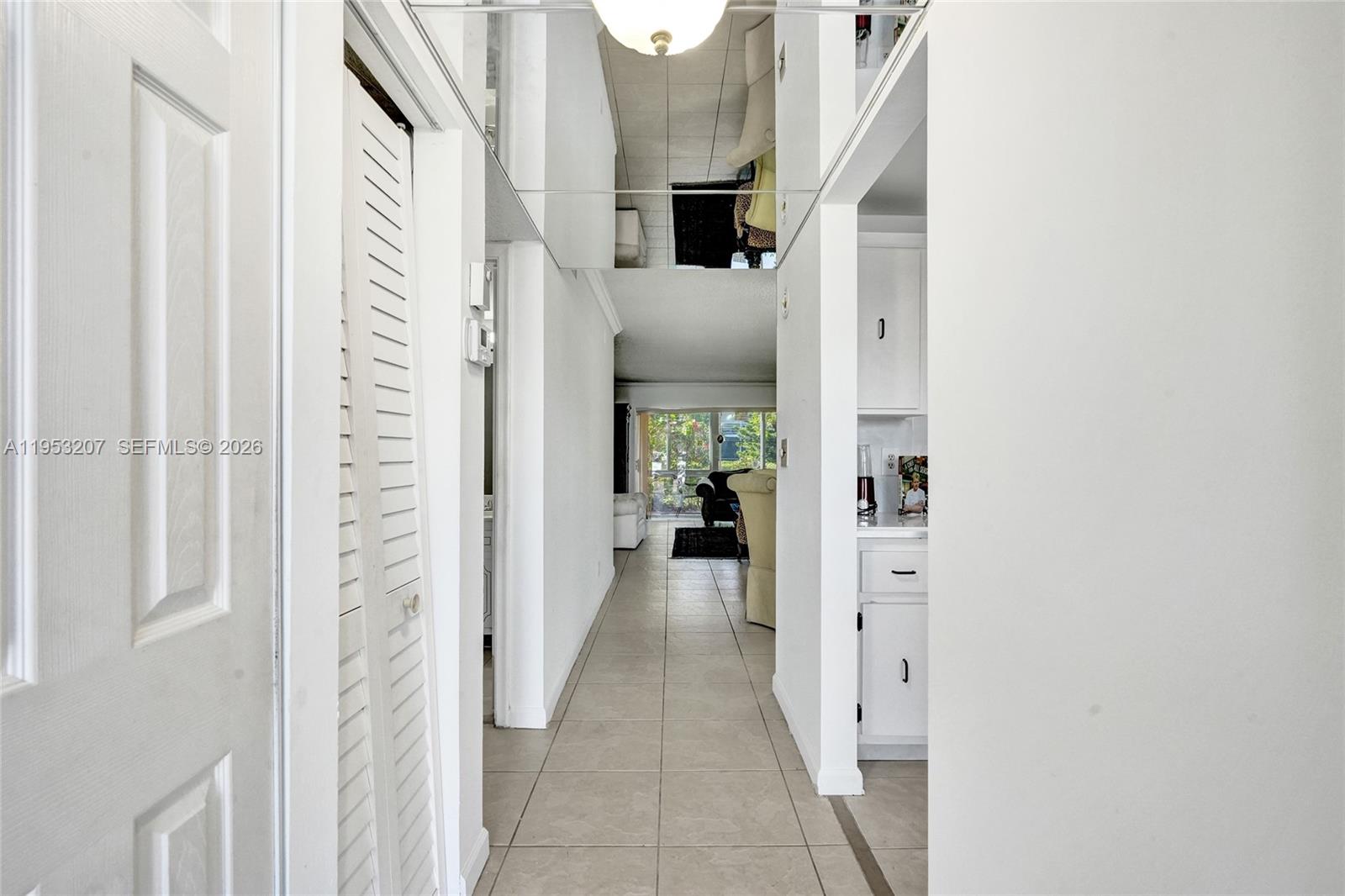 3511 Inverrary Drive, Unit 107 Lauderhill, FL 33319 - Photo 8 of 47 a view of a hallway with a white walls and stairs