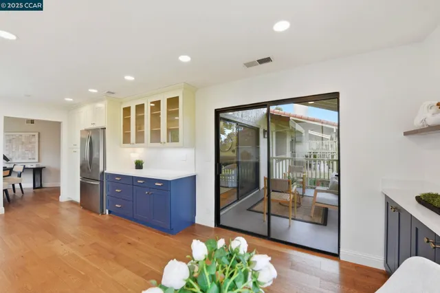 a spacious bathroom with a glass door shower and a sink
