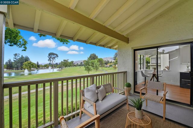 a view of a balcony with furniture