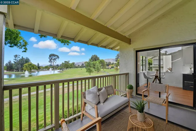 a view of a balcony with furniture