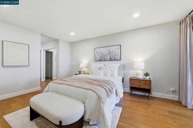 a bedroom with a bed and chair