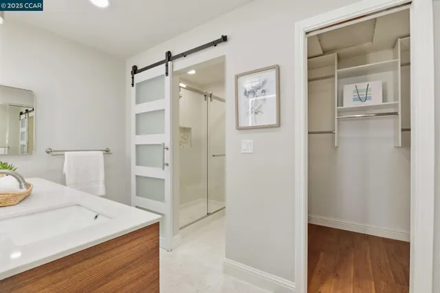 a view of a bathroom with a shower and sink