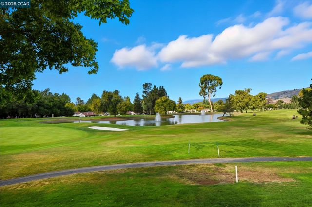 a view of a golf course with a lake