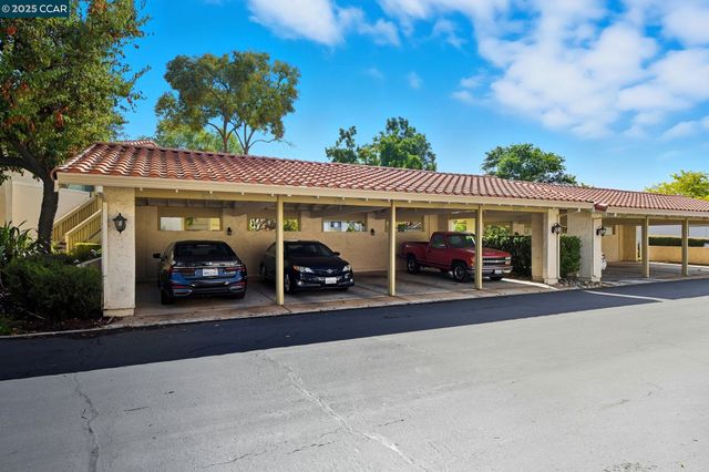 a view of a car park in front of house
