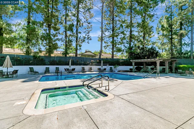 a view of swimming pool with chairs