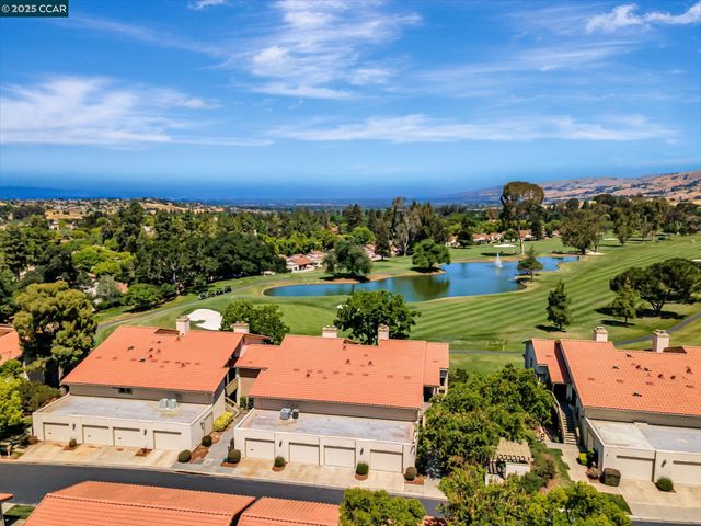 an aerial view of a house with a garden