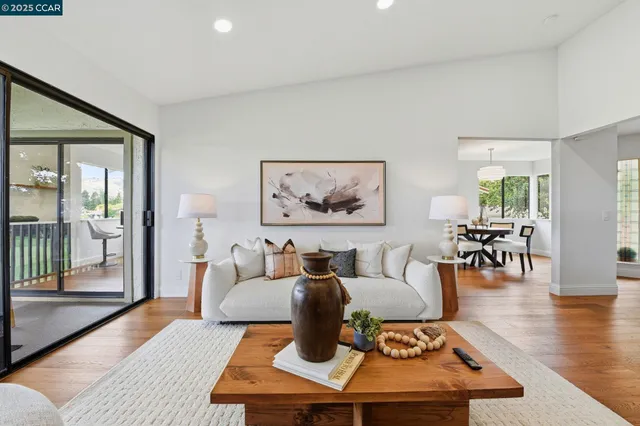 a living room with furniture and a table