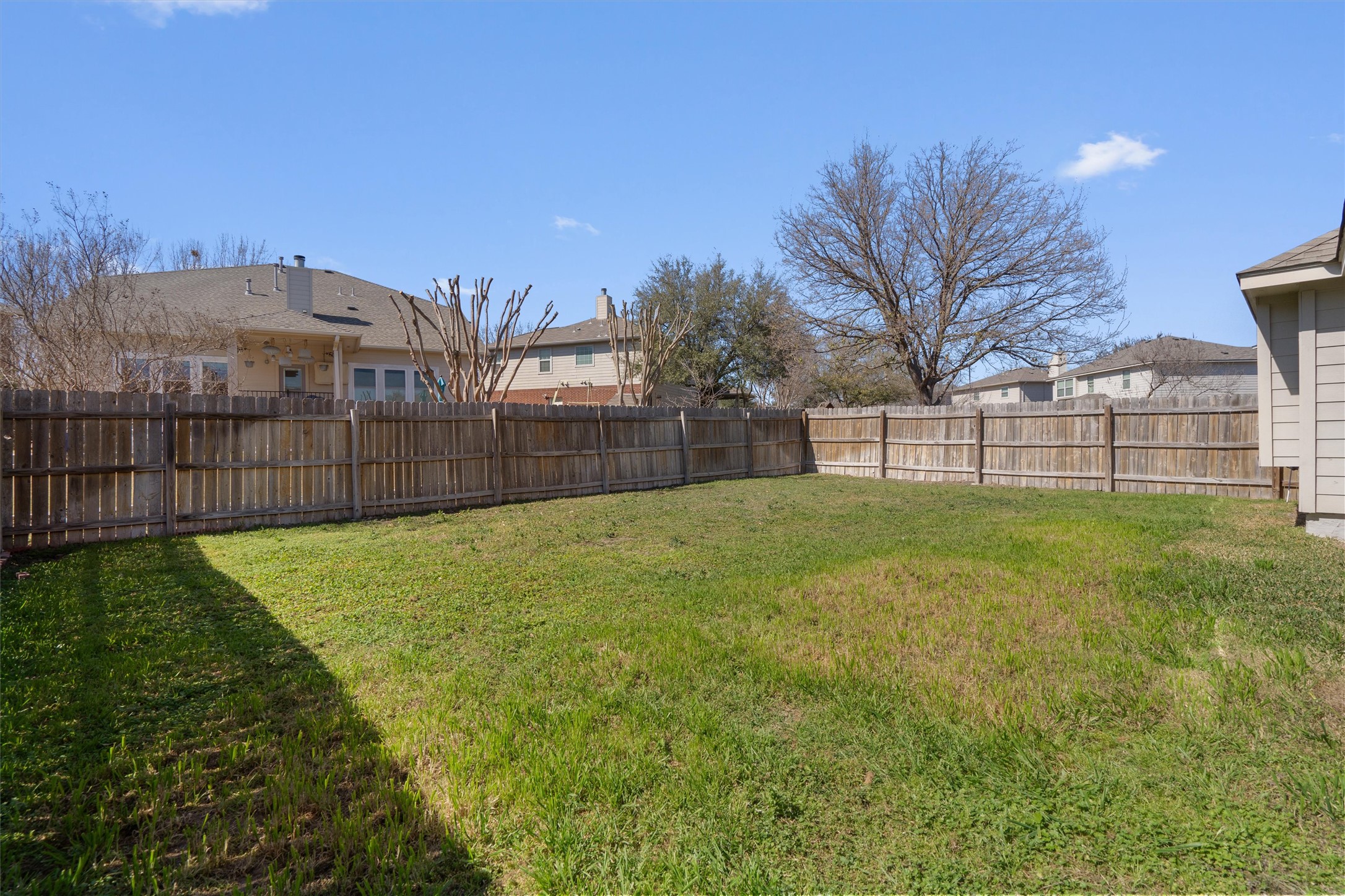 2801 Kickapoo Cavern Drive Pflugerville, TX 78660 - Photo 32 of 38 Fenced backyard with a residential view
