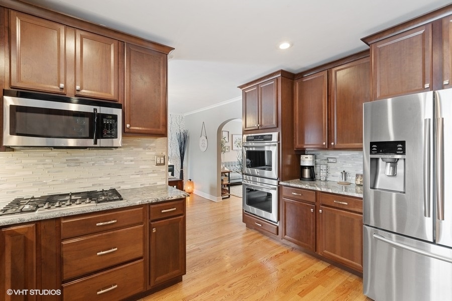 442 Kent Road Riverside, IL 60546 - Photo 16 of 45 a kitchen with stainless steel appliances granite countertop a refrigerator stove microwave and sink