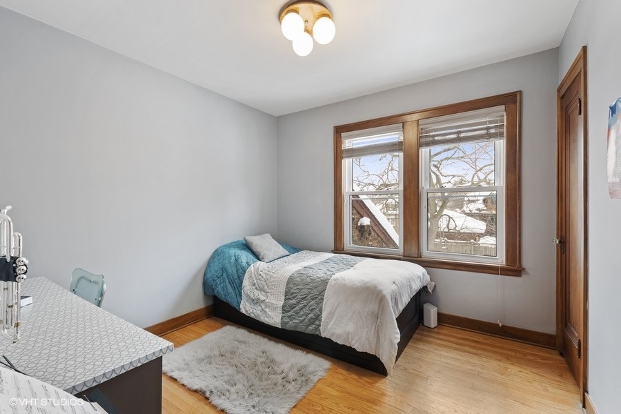 442 Kent Road Riverside, IL 60546 - Photo 27 of 45 a bedroom with a bed lamp and window