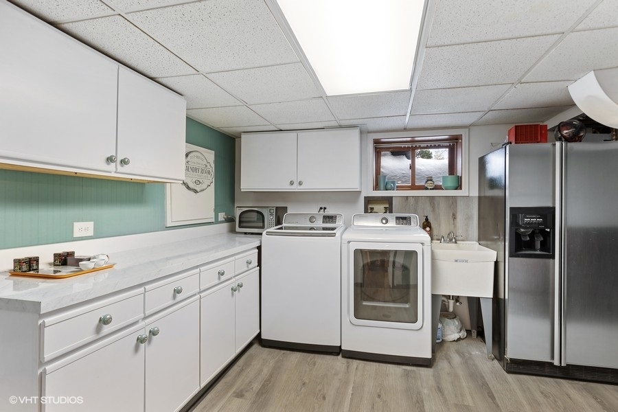 442 Kent Road Riverside, IL 60546 - Photo 33 of 45 a kitchen with white cabinets and white appliances