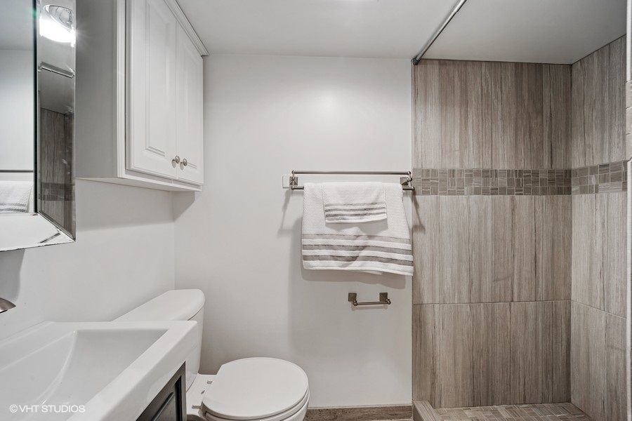 442 Kent Road Riverside, IL 60546 - Photo 35 of 45 a bathroom with a sink a toilet and shower