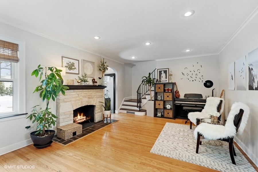 442 Kent Road Riverside, IL 60546 - Photo 6 of 45 a living room with furniture and a fireplace