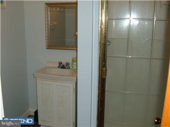 626 Polk Street Riverside, NJ 08075 - Photo 12 of 12 a bathroom with a sink and mirror
