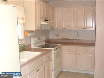 626 Polk Street Riverside, NJ 08075 - Photo 5 of 12 a kitchen with granite countertop white cabinets and sink