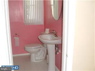 626 Polk Street Riverside, NJ 08075 - Photo 8 of 12 a bathroom with a sink toilet and a mirror