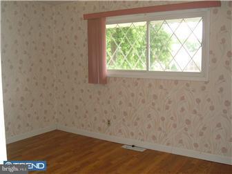 626 Polk Street Riverside, NJ 08075 - Photo 9 of 12 a view of a small space with wooden floor and a window