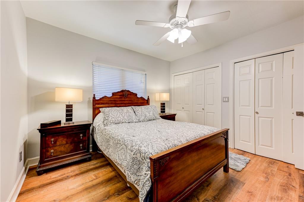 2075 Clairmeade Valley Road Northeast Atlanta, GA 30329 - Photo 13 of 51 a bed room with a bed and a ceiling fan