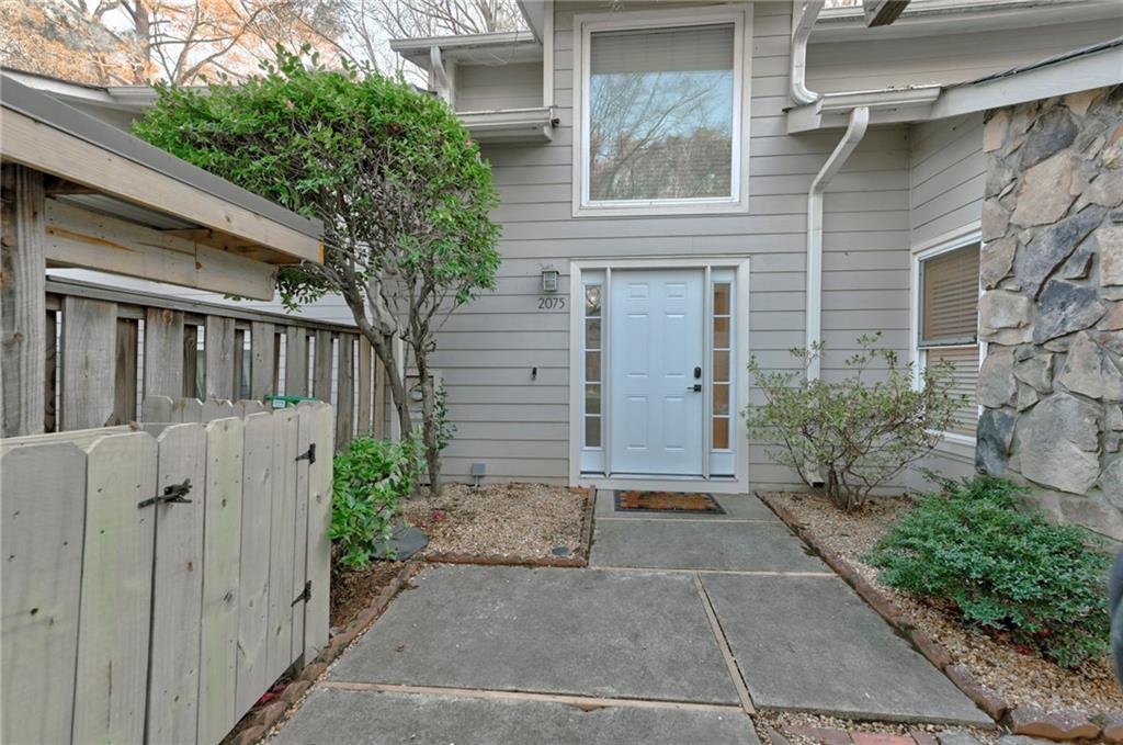 2075 Clairmeade Valley Road Northeast Atlanta, GA 30329 - Photo 15 of 51 a view of backyard with potted plants and wooden fence