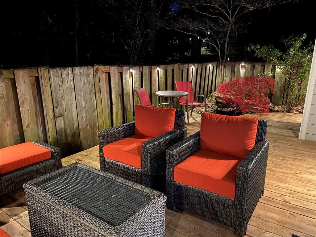 2075 Clairmeade Valley Road Northeast Atlanta, GA 30329 - Photo 19 of 51 a outdoor sitting area with chairs and a table