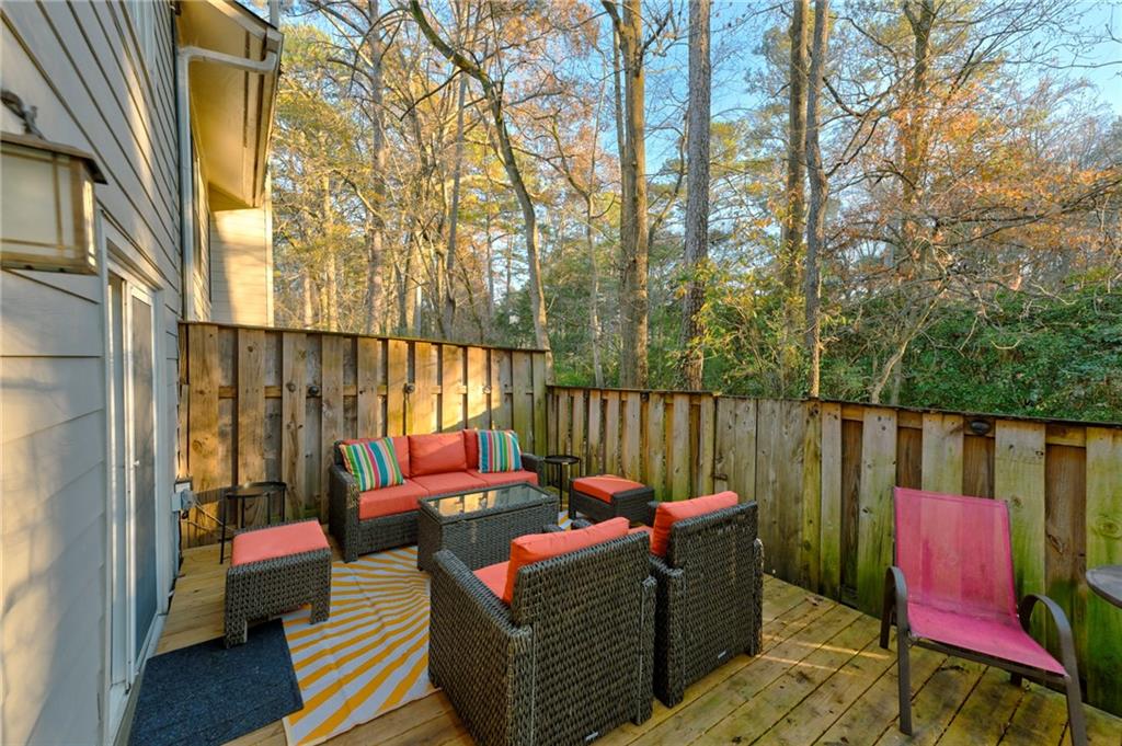 2075 Clairmeade Valley Road Northeast Atlanta, GA 30329 - Photo 20 of 51 a balcony with chairs and a table
