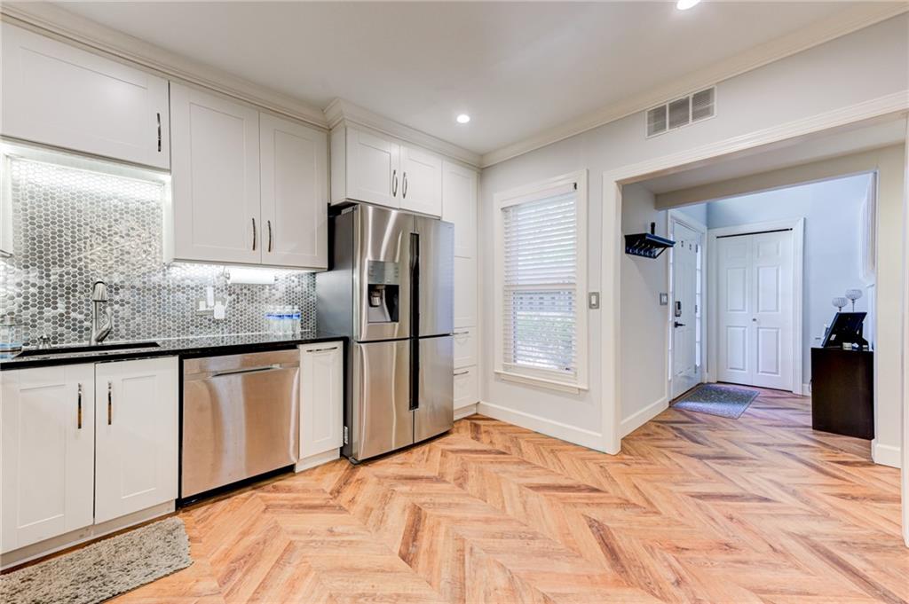 2075 Clairmeade Valley Road Northeast Atlanta, GA 30329 - Photo 27 of 51 a kitchen with stainless steel appliances granite countertop a refrigerator and a sink