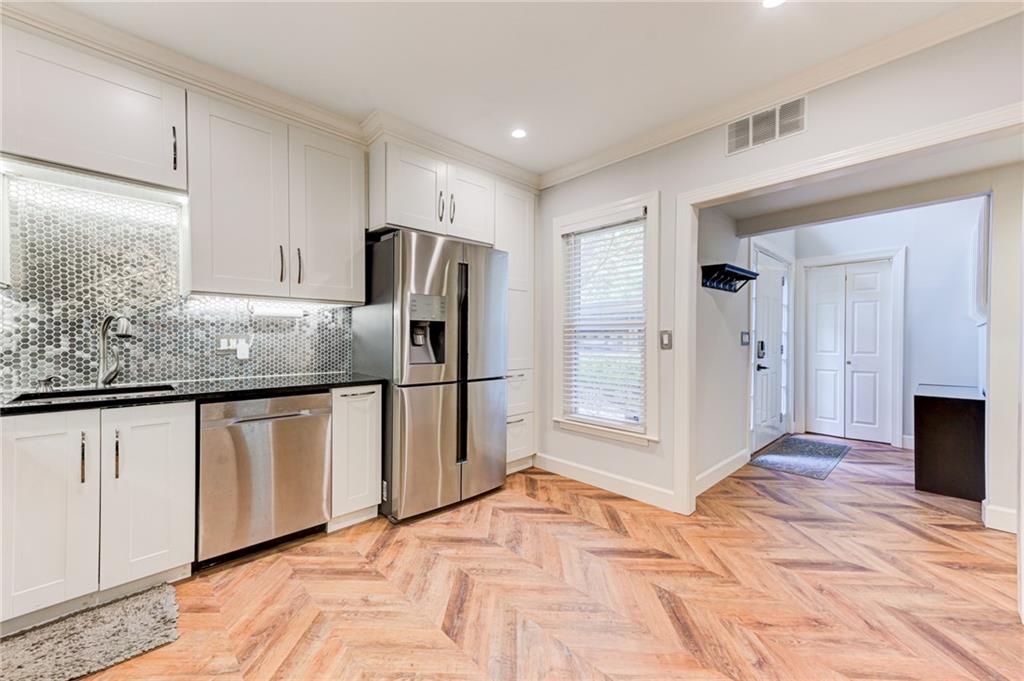 2075 Clairmeade Valley Road Northeast Atlanta, GA 30329 - Photo 33 of 51 a kitchen with stainless steel appliances granite countertop a refrigerator and a sink