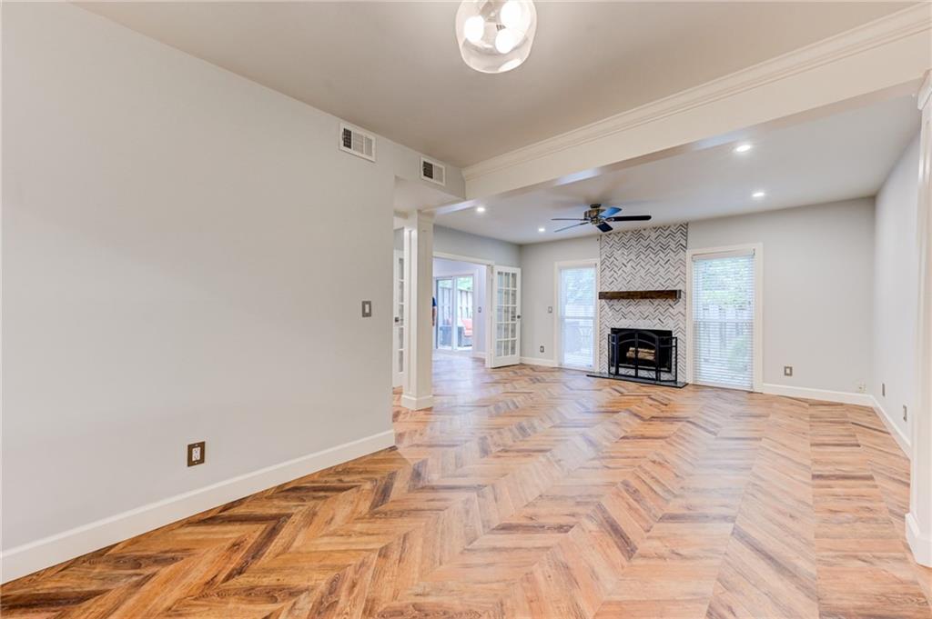 2075 Clairmeade Valley Road Northeast Atlanta, GA 30329 - Photo 35 of 51 a view of empty room with wooden floor and fireplace