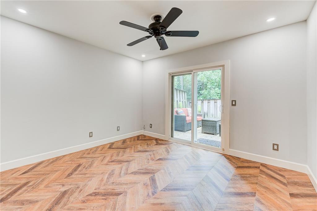 2075 Clairmeade Valley Road Northeast Atlanta, GA 30329 - Photo 38 of 51 a view of empty room with wooden floor and fan