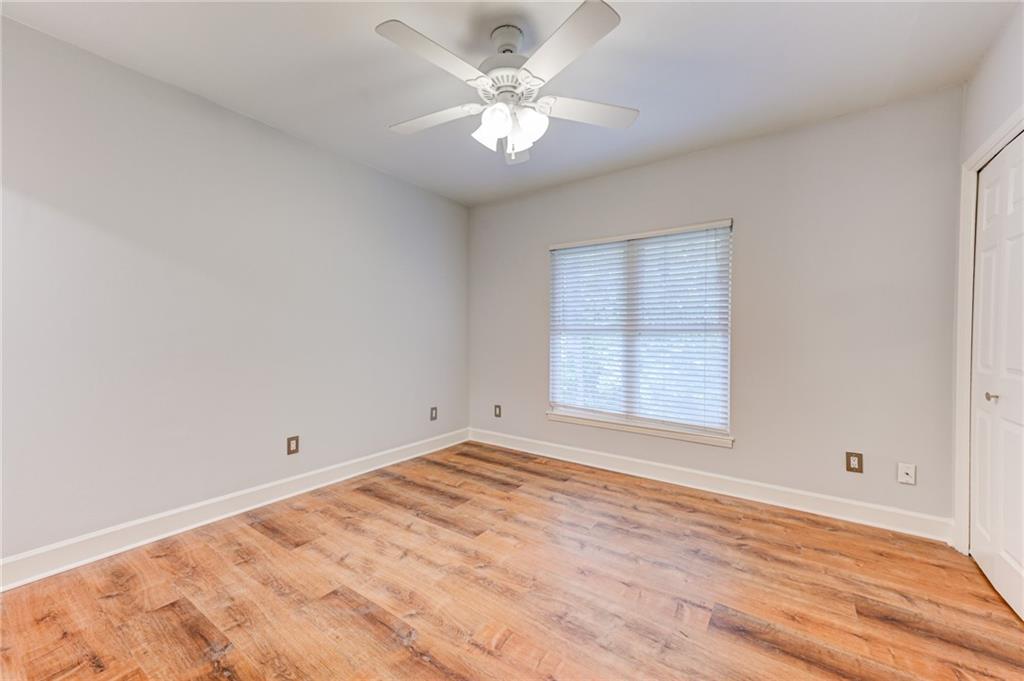 2075 Clairmeade Valley Road Northeast Atlanta, GA 30329 - Photo 48 of 51 wooden floor in an empty room with a window