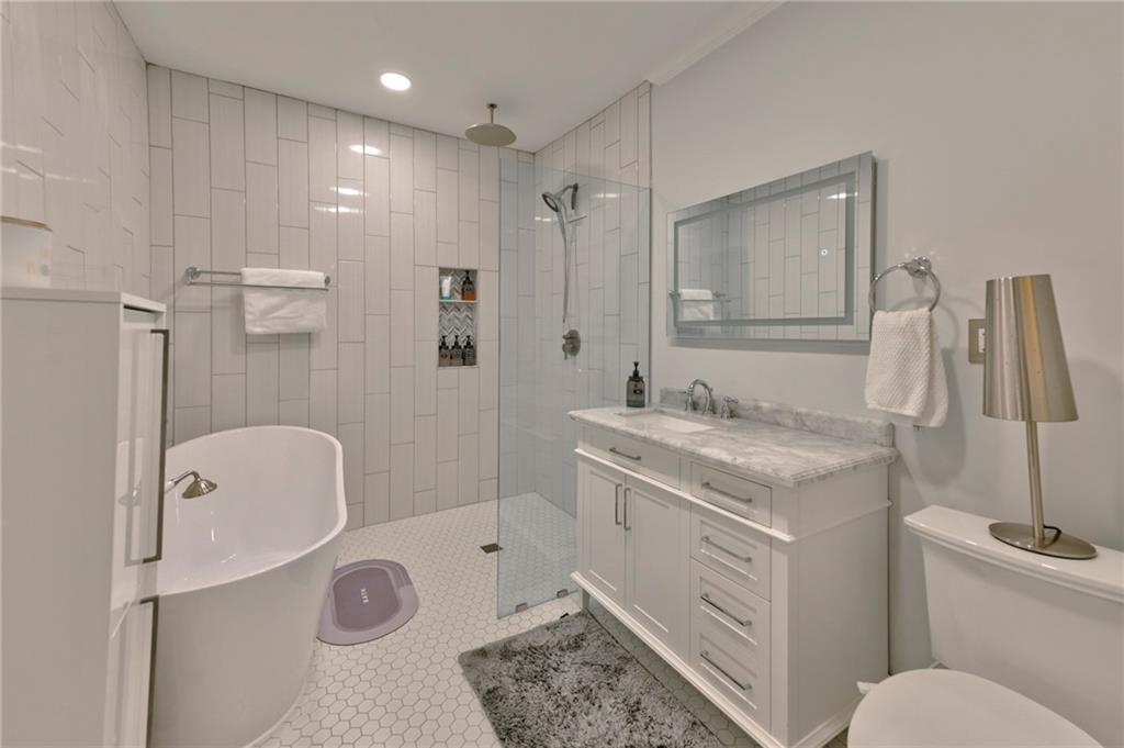 2075 Clairmeade Valley Road Northeast Atlanta, GA 30329 - Photo 10 of 51 a bathroom with a granite countertop sink toilet and shower