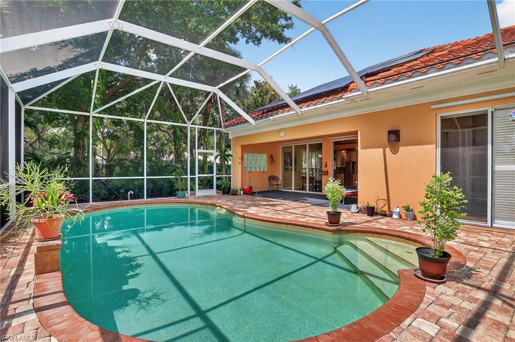 5902 Bermuda Lane Naples, FL 34119 - Photo 2 of 50 a view of a backyard with swimming pool and furniture