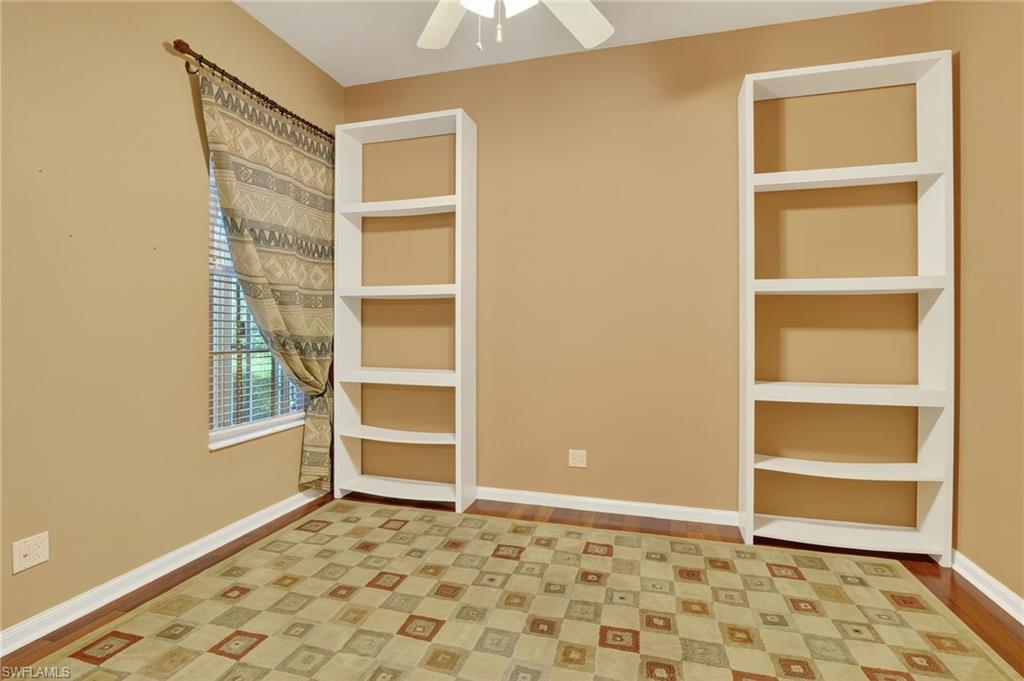 5902 Bermuda Lane Naples, FL 34119 - Photo 23 of 50 a view of an empty room with cabinet and a window