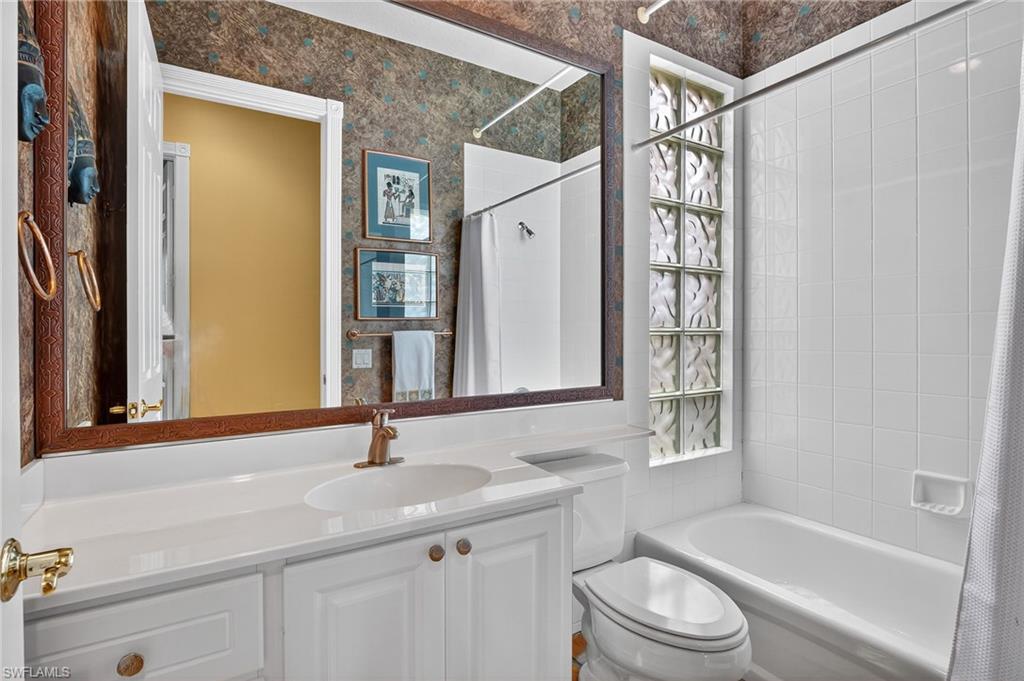 5902 Bermuda Lane Naples, FL 34119 - Photo 26 of 50 a bathroom with a sink a toilet and shower