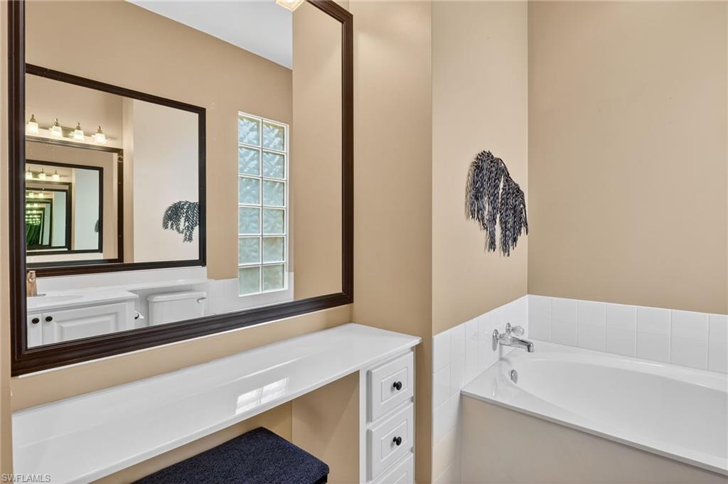 5902 Bermuda Lane Naples, FL 34119 - Photo 35 of 50 a bathroom with a bathtub and a sink