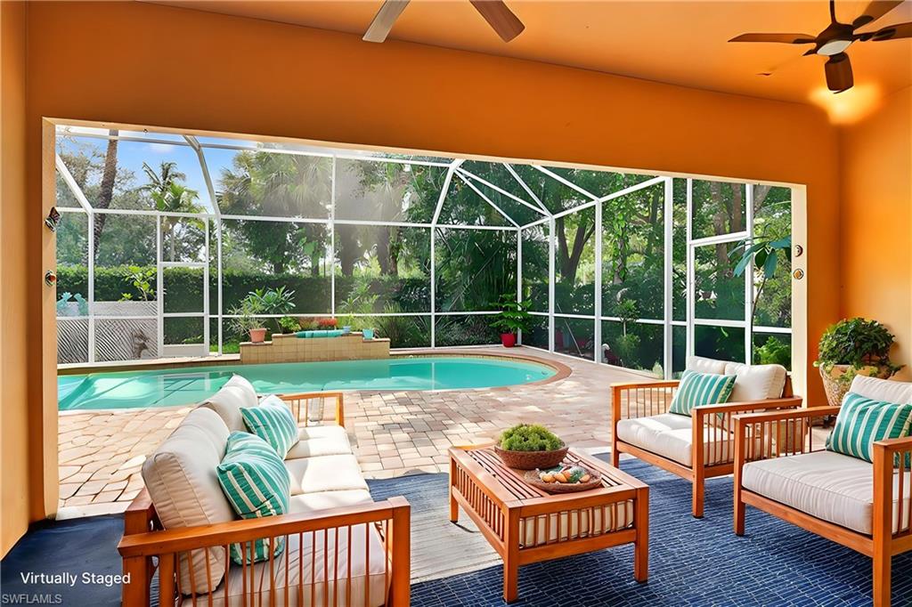 5902 Bermuda Lane Naples, FL 34119 - Photo 37 of 50 a view of a patio with couches chairs and wooden floor