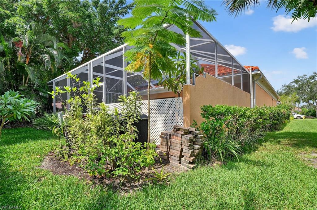 5902 Bermuda Lane Naples, FL 34119 - Photo 44 of 50 a house view with a garden space