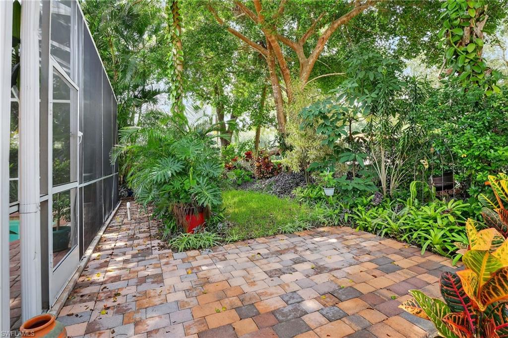 5902 Bermuda Lane Naples, FL 34119 - Photo 45 of 50 a view of a pathway both side of house