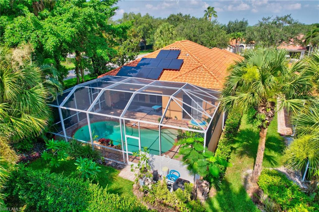 5902 Bermuda Lane Naples, FL 34119 - Photo 50 of 50 a backyard of a house with lots of green space