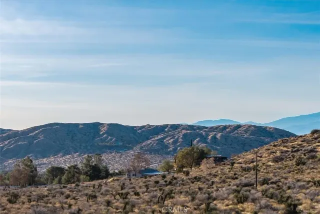 a view of mountains and valleys