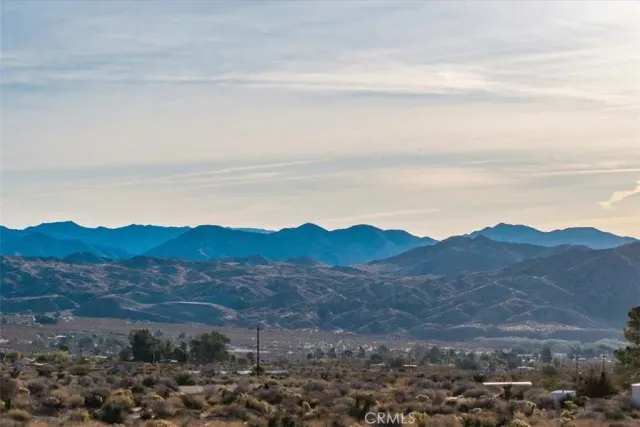 a view of mountains and valleys