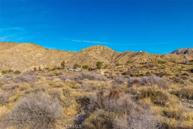 a view of a mountain view with mountains in the background