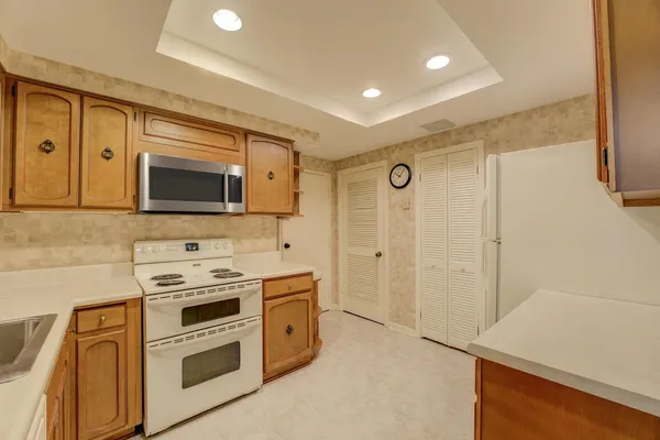 a view of a kitchen with electric appliances