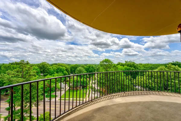 a view of balcony with furniture