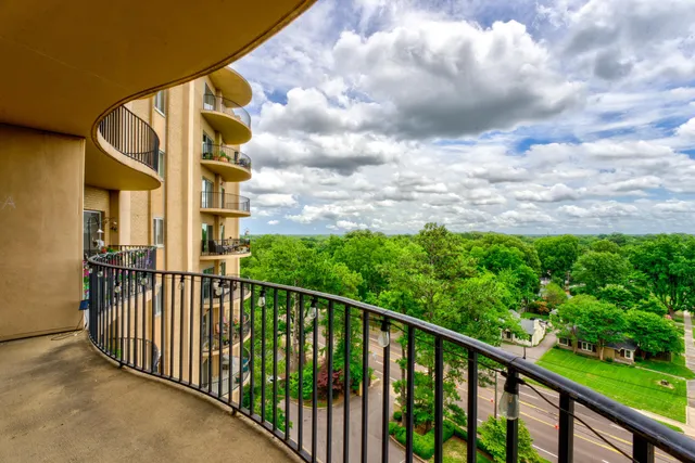 a view of balcony with furniture