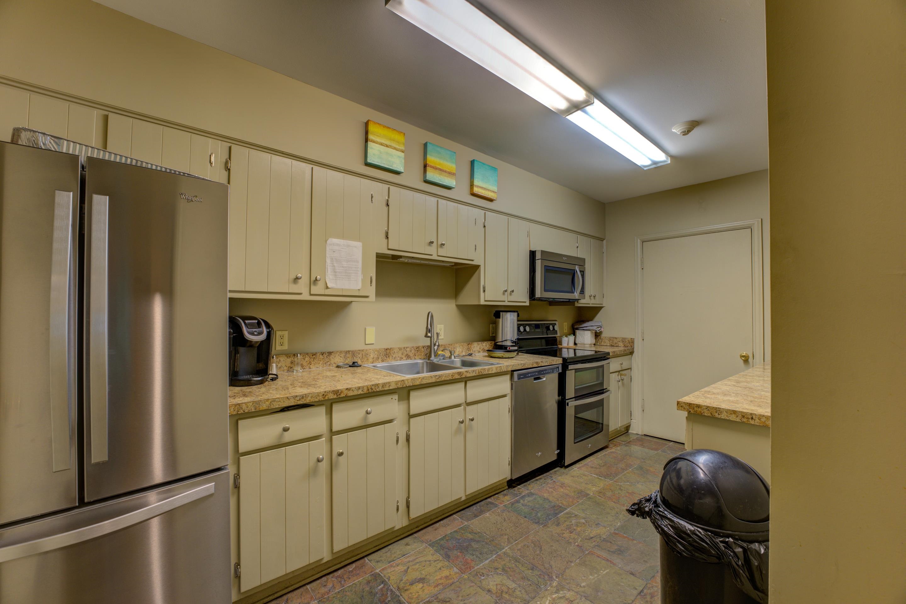 475 North Highland Street, Unit 9AB Memphis, TN 38122 - Photo 36 of 40 a kitchen with stainless steel appliances granite countertop a sink stove and refrigerator